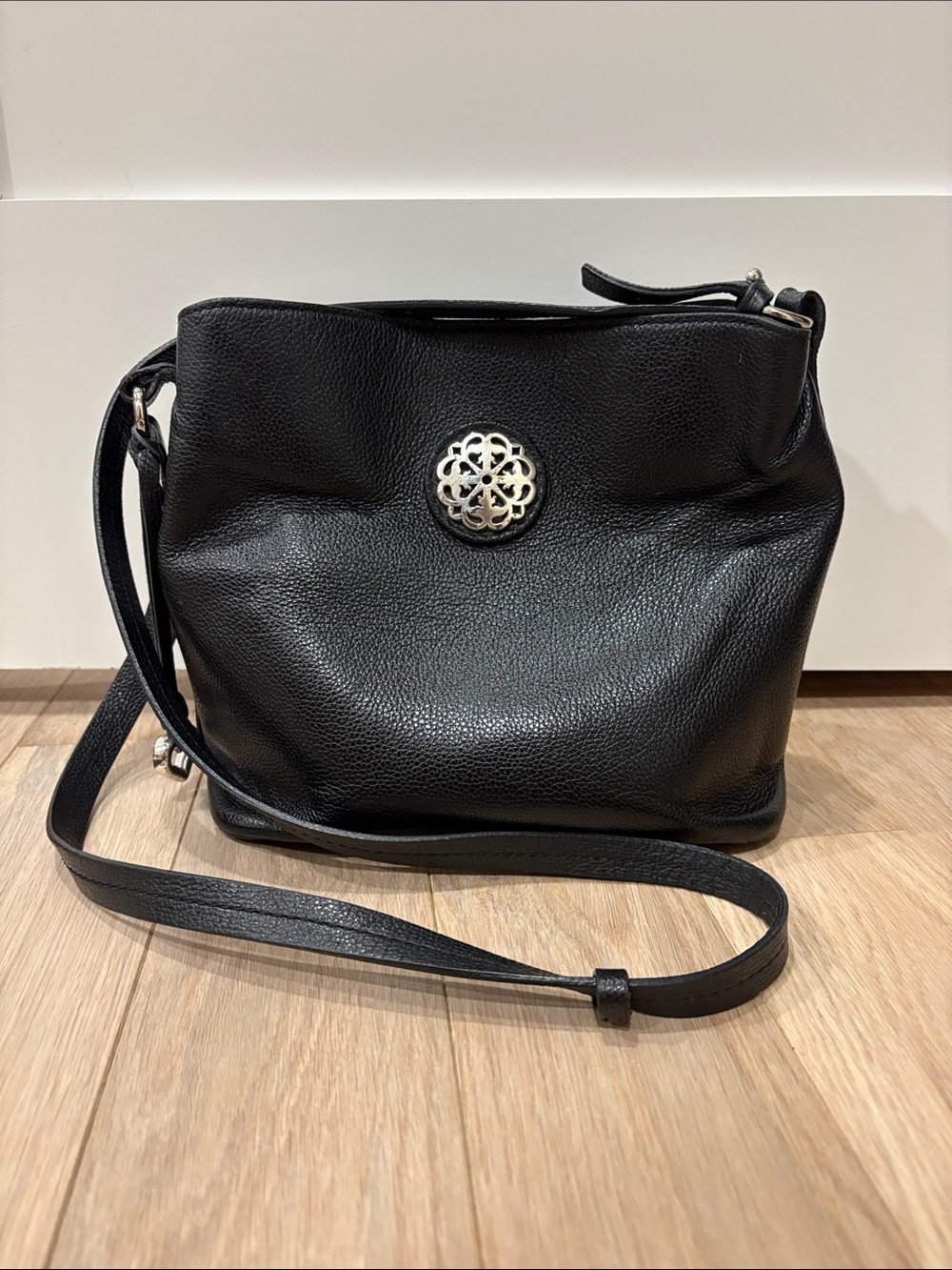 Brighton Ferrara Noelle Black Pebbled Leather Crossbody Bucket Bag Medallion